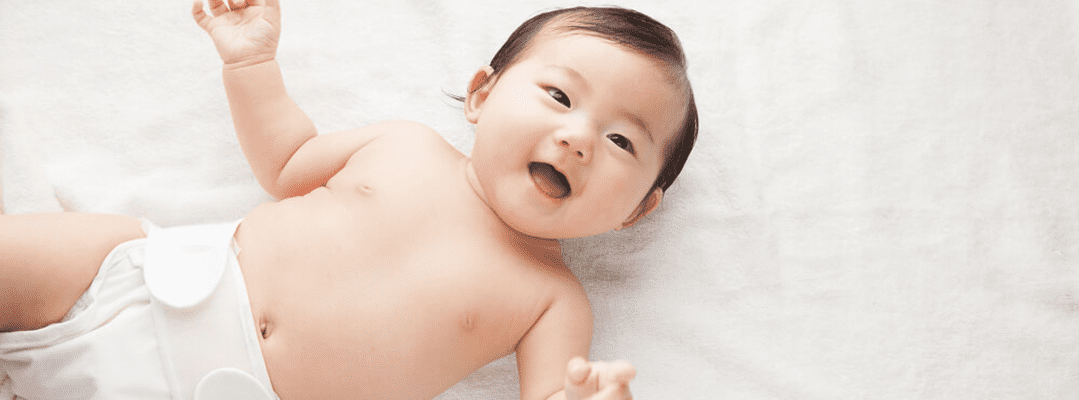 skin care on body and face for smiling baby